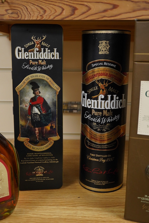 Four bottles of Whisky to include The Glenlivet 12 years aged single malt and two bottles of Glenfiddich, together with a bottle of brandy